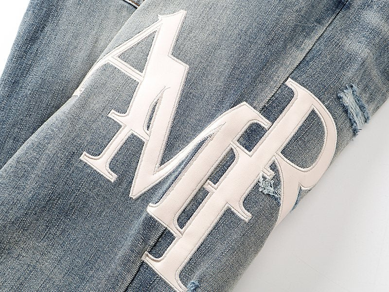 AMIRI Light Blue Distressed Letter Graphic Jeans ¡ª detail